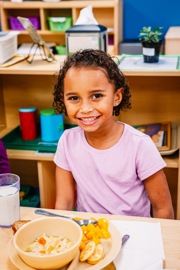 Girl with plate of food